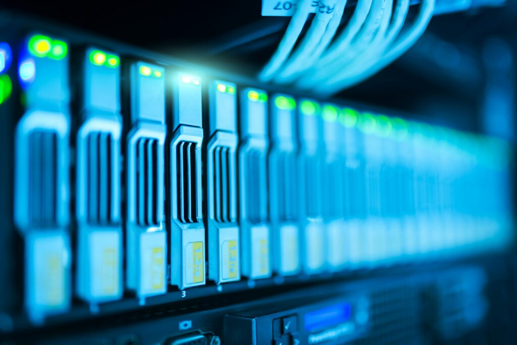 pexels photo 1148820 1148820 Detailed image of a server rack with glowing lights in a modern data center.