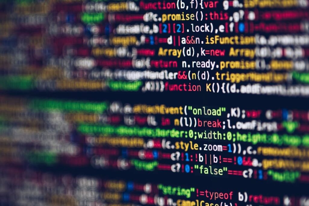 pexels photo 2004161 Vivid, blurred close-up of colorful code on a screen, representing web development and programming.
